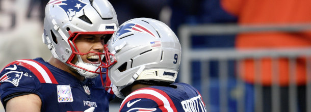 New England Patriots football stars Henry and Boute celebrate a touchdown in an NFL game