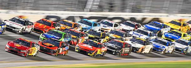 NASCAR cars race around the track in a Cup Series race